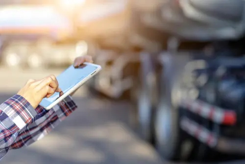 Truck Driver Holding Tablet